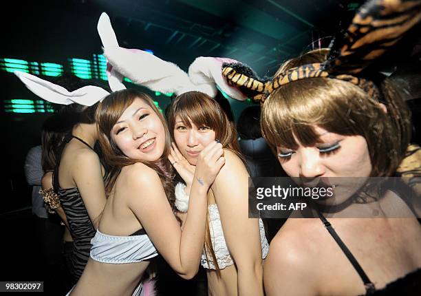 Women pose for a photo at a club during a "ladies night" promotion in the Chung-Li area of Taoyuan county, north of Taipei in northern Taiwan on...