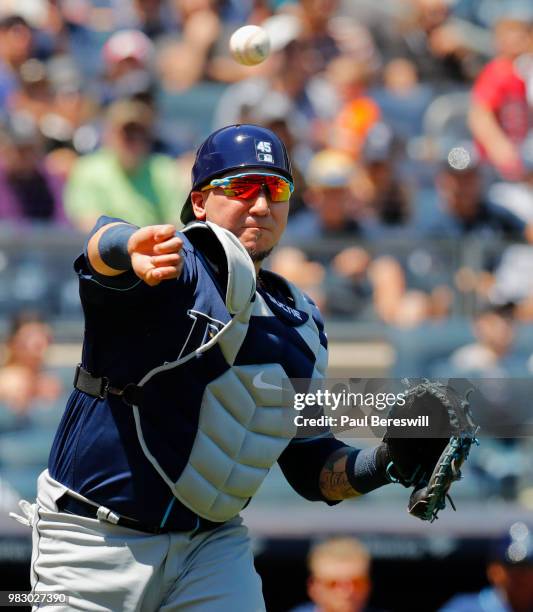 Catcher Jesus Sucre of the Tampa Bay Rays throws to first base during an MLB baseball game against the New York Yankees on June 16, 2018 at Yankee...