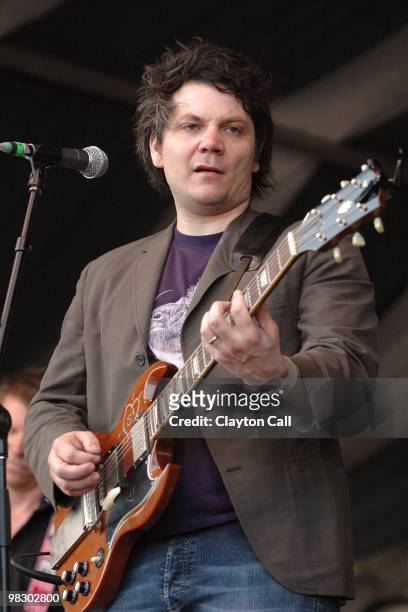 Jeff Tweedy of Wilco performing on stage at the New Orleans Jazz & Heritage Festival on April 22, 2005. He plays a Gibson SG guitar.
