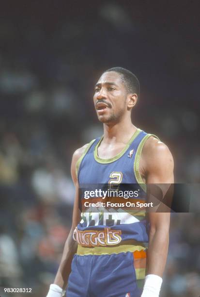 Alex English of the Denver Nuggets looks on against the Washington Bullets during an NBA basketball game circa 1989 at the Capital Centre in...