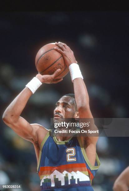 Alex English of the Denver Nuggets shoots a free throw against the Washington Bullets during an NBA basketball game circa 1989 at the Capital Centre...