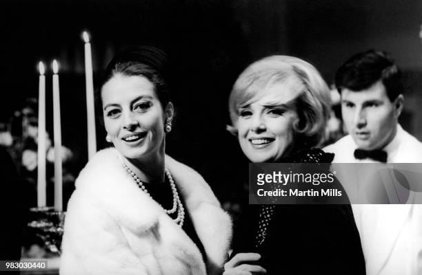 Actress Capucine and American comedienne, actress, singer and businesswoman Edie Adams pose for a portrait during the movie "The Honey Pot" circa...