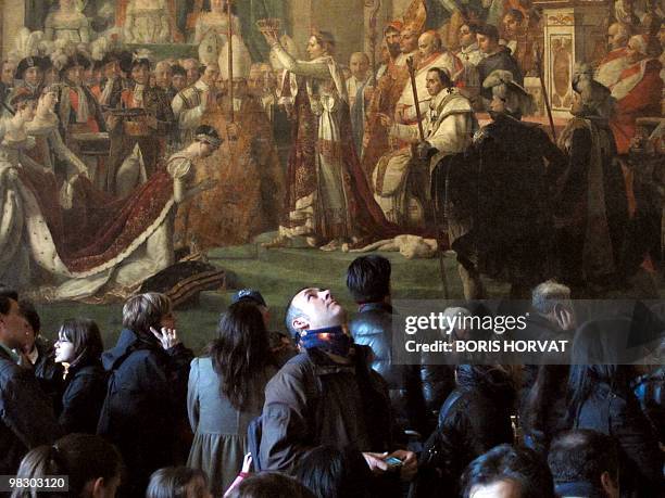 Man looks up as he visits a room in the Chateau de Versailles, on April 4, 2010 in Versailles, outside Paris. The Palace of Versailles was the main...
