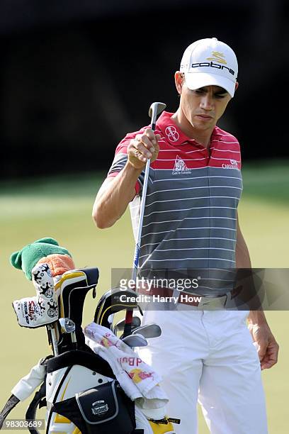 Camilo Villegas of Colombia pulls a club from his bag during a practice round prior to the 2010 Masters Tournament at Augusta National Golf Club on...