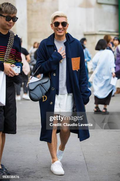 Bryan Boy, wearing Loewe blue coat and Dior black bag, is seen in the streets of Paris after the Lanvin show, during Paris Men's Fashion Week...