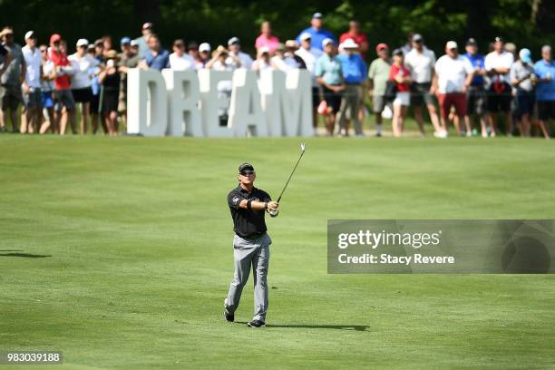 Scott McCarron hits his second shot on the 18th hole during the third and final round of the American Family Championship at University Ridge Golf...