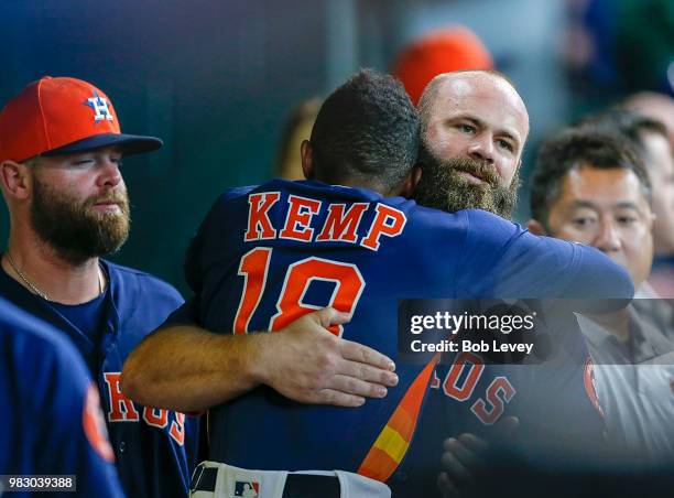 Evan Gattis of the Houston Astros is congratulated by Tony Kemp after hitting a home run in the eighth inning against the Kansas City Royals at...