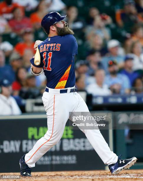 Evan Gattis of the Houston Astros hits a home run in the eighth inning against the Kansas City Royals at Minute Maid Park on June 24, 2018 in...