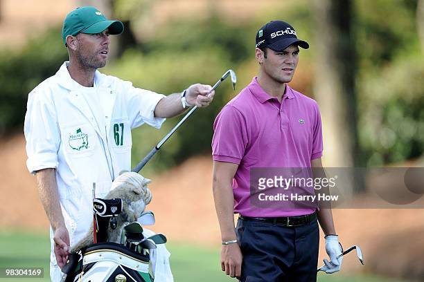 Martin Kaymer of Germany stands alongside caddie Justin Grenfell-Hoyle during a practice round prior to the 2010 Masters Tournament at Augusta...