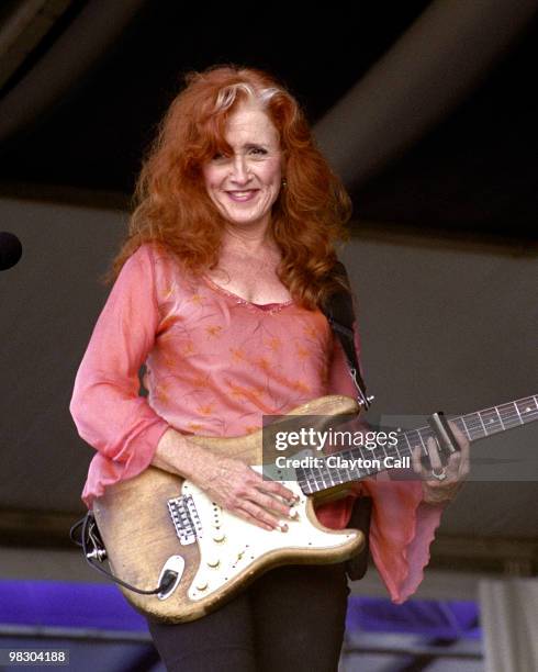 Bonnie Raitt performing with fender stratocaster at the New Orleans Jazz & Heritage Festival on May 03 2002