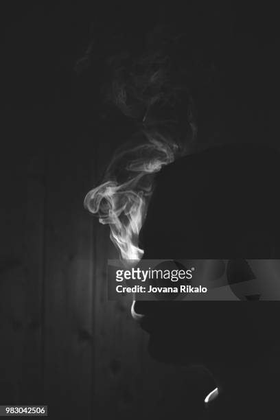 man in smoke - jovanat stock pictures, royalty-free photos & images