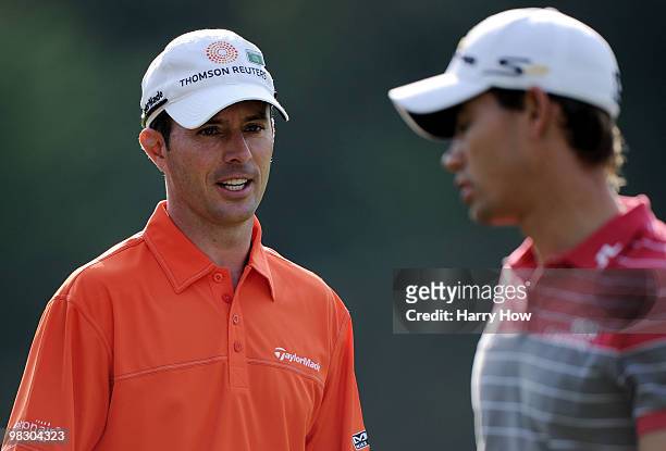 Mike Weir of Canada talks with Camilo Villegas of Colombia during a practice round prior to the 2010 Masters Tournament at Augusta National Golf Club...