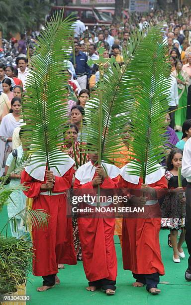 Altar boys lead a Palm Sunday procession at the Saint Mary's Church in Secunderabad, the twin city of Hyderabad, on March 28, 2010. Palm Sunday marks...