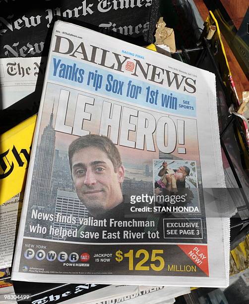 The front page of the New York Daily News April 7, 2010 featuring Julien Duret of Lyon, France, who helped save a baby that fell into New York's East...