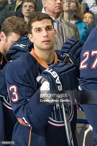 Andrew Cogliano of the Edmonton Oilers stands for the national anthems before a game against the Minnesota Wild at Rexall Place on April 5, 2010 in...