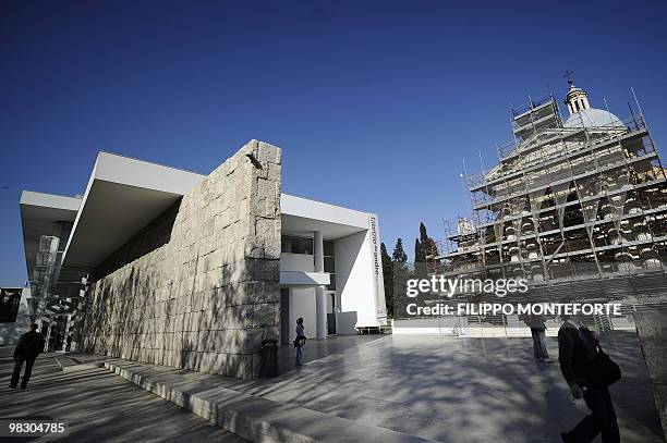 People walk by the Ara Pacis museum on April 7, 2010 in Rome. Rome's mayor Gianni Alemanno, who called the building in 2006 "a scar in the heart of...