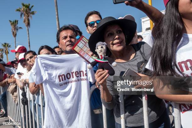 Supporter holds a doll in the likeness of Andres Manuel Lopez Obrador, presidential candidate of the National Regeneration Movement Party , during...