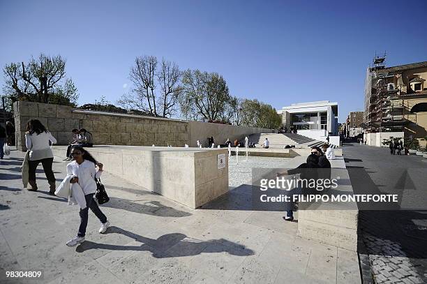 People pass by the Ara Pacis museum on April 7, 2010 in Rome. Rome's mayor Gianni Alemanno, who called the building in 2006 "a scar in the heart of...