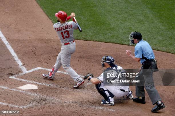 Matt Carpenter of the St. Louis Cardinals hits a single in the fourth inning against the Milwaukee Brewers at Miller Park on June 24, 2018 in...