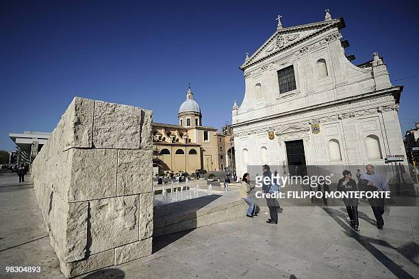 People pass by the Ara Pacis museum on April 7, 2010 in Rome. Rome's mayor Gianni Alemanno, who called the building in 2006 "a scar in the heart of...