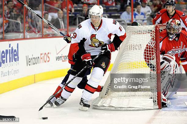 Jason Spezza of the Ottawa Senators brings the puck around the net against the Washington Capitals at the Verizon Center on March 30, 2010 in...