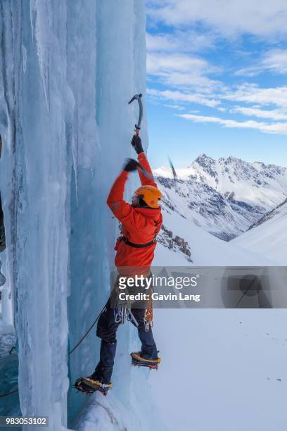 an ice climber in the southern alps, new zealand. - crampon stock pictures, royalty-free photos & images