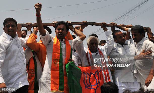 Andhra Pradash state president of the Bharatiya Janata Party G. Kishan Reddy shouts slogans as he and other protestors are detained by police in...
