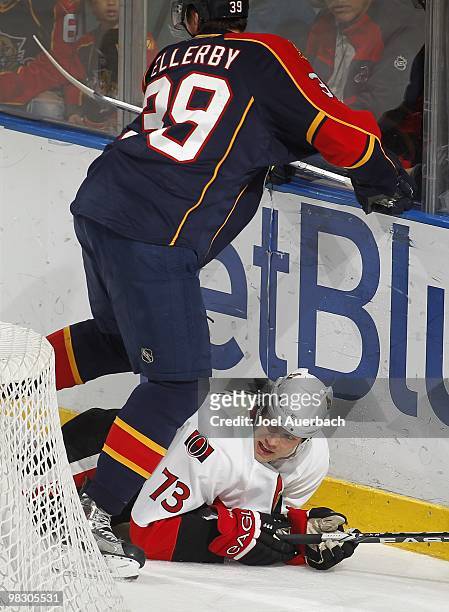 Jarkko Ruutu of the Ottawa Senators is checked to the ice by Keaton Ellerby of the Florida Panthers on April 6, 2010 at the BankAtlantic Center in...