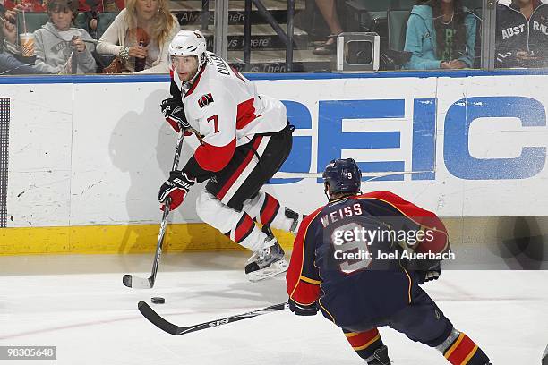 Matt Cullen of the Ottawa Senators skates with the puck while being defended by Stephen Weiss of the Florida Panthers on April 6, 2010 at the...