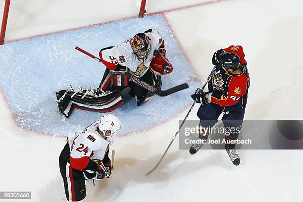 Goaltender Pascal Leclaire of the Ottawa Senators stops the shot by Shawn Matthias of the Florida Panthers with his shoulder on April 6, 2010 at the...