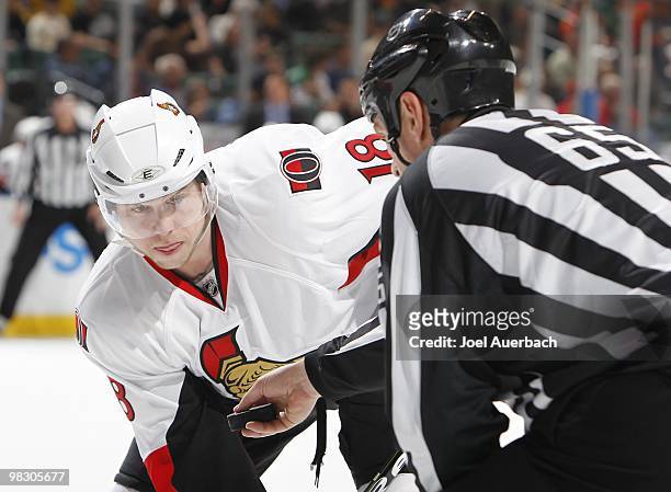 Jesse Winchester of the Ottawa Senators waits for a face off from linesman Pierre Racicot against the Florida Panthers on April 6, 2010 at the...