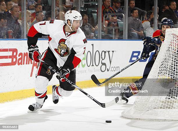 Matt Cullen of the Ottawa Senators attempts to pass the puck in front of the Florida Panthers net on April 6, 2010 at the BankAtlantic Center in...