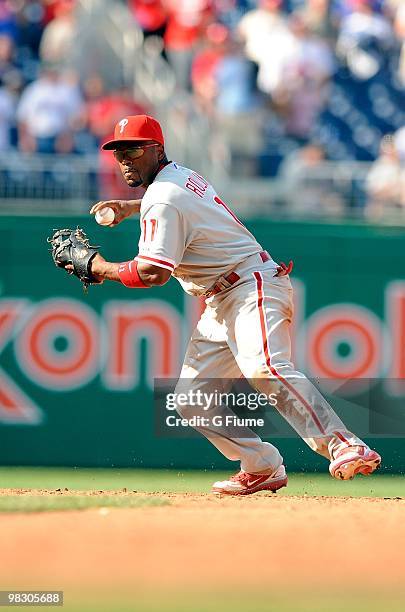 Jimmy Rollins of the Philadelphia Phillies throws the ball to first base during the game against the Washington Nationals on Opening Day at Nationals...