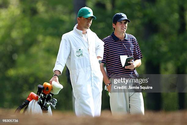 Amateur Ben Martin stands alongside caddie Robert Thompson during a practice round prior to the 2010 Masters Tournament at Augusta National Golf Club...