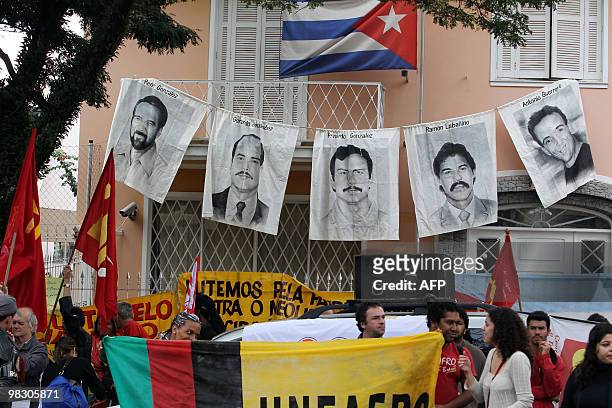 Posters with portraits of five Cubans jailed in the United States - Rene Gonzalez Sehwerert, Gerardo Hernandez Nordelo, Fernando Gonzalez Llort,...