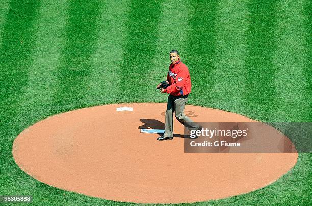 President of the United States Barack Obama throws out the opening pitch before the game between the Philadelphia Phillies and the Washington...