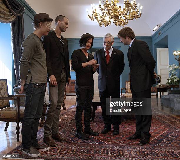 Chilean President Sebastian Piñera and his Culture Minister Luciano Cruz Coke receive the members of the British band Placebo at La Moneda...