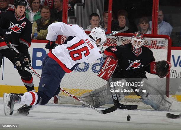 Eric Fehr of the Washington Capitals takes a shot on net during their NHL game against the Carolina Hurricanes on March 25, 2010 at the RBC Center in...