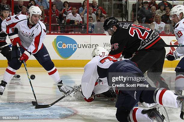 Erik Cole of the Carolina Hurricanes attempts to find the back of the net with the puck during their NHL game against the Washington Capitals on...
