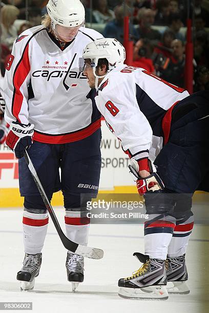 Alexander Semin and Alex Ovechkin of the Washington Capitals discuss strategies during their NHL game against the Carolina Hurricanes on March 25,...
