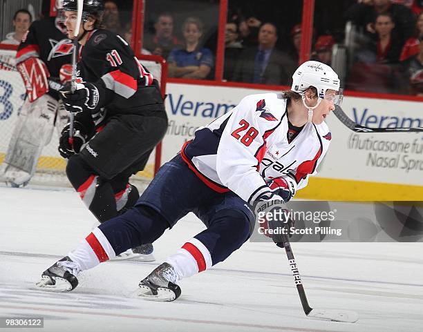 Alexander Semin of the Washington Capitals prepares to carry to carry the puck into the defensive zone of the Carolina Hurricanes during their NHL...