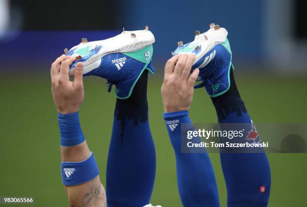 Kevin Pillar of the Toronto Blue Jays stretches while wearing Adidas cleats before the start of MLB game action against the Atlanta Braves at Rogers...
