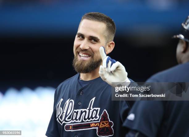 Ender Inciarte of the Atlanta Braves talks to first base coach Eric Young during a pitching change in the fourth inning during MLB game action...