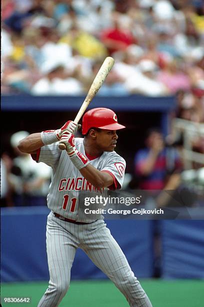 Shortstop Barry Larkin of the Cincinnati Reds bats against the Pittsburgh Pirates during a Major League Baseball game at Three Rivers Stadium in 1994...