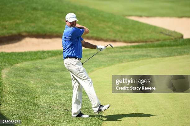 Jerry Kelly reacts to a missed birdie chip on the 18th green during the third and final round of the American Family Championship at University Ridge...