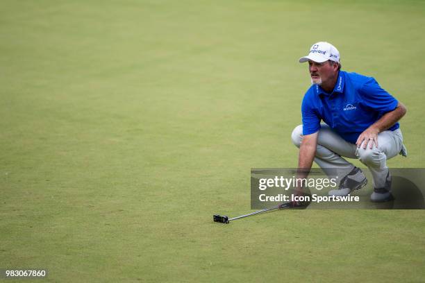 Jerry Kelly reads the line for his par putt at the 18th green during American Family Insurance Championship on June 24th, 2018 at the University...