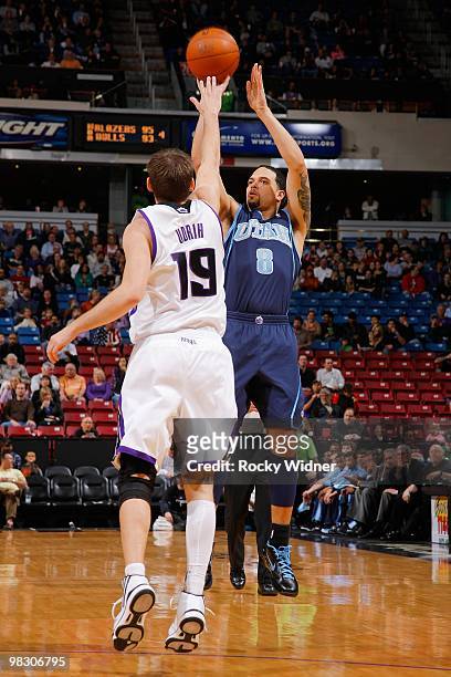 Deron Williams of the Utah Jazz shoots against Beno Udrih of the Sacramento Kings during the game on February 26, 2010 at Arco Arena in Sacramento,...