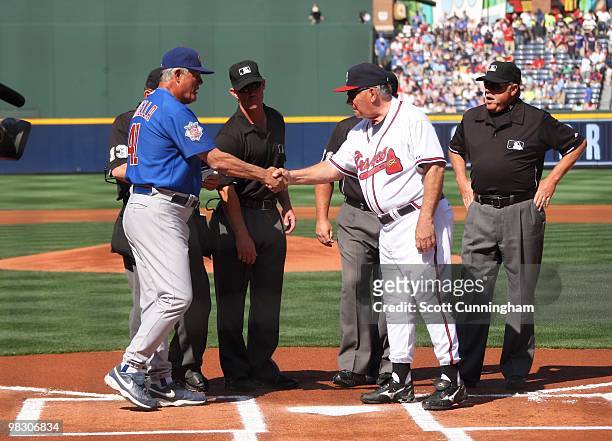 Manager Bobby Cox of the Atlanta Braves greets Manager Lou Piniella the Chicago Cubs before the Opening Day game at Turner Field on April 5, 2010 in...