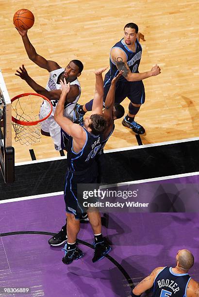 Tyreke Evans of the Sacramento Kings goes to the basket against Mehmet Okur of the Utah Jazz during the game on February 26, 2010 at Arco Arena in...