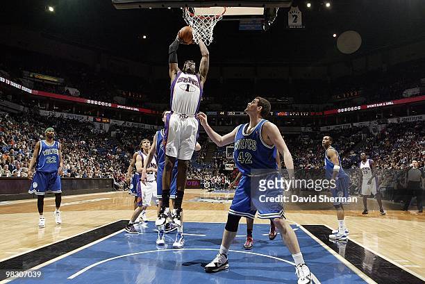 Amar'e Stoudemire of the Phoenix Suns goes to the basket against Kevin Love of the Minnesota Timberwolves during the game on March 28, 2010 at the...